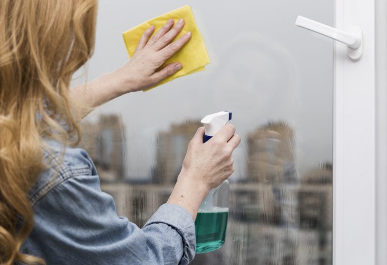 woman-washing-window